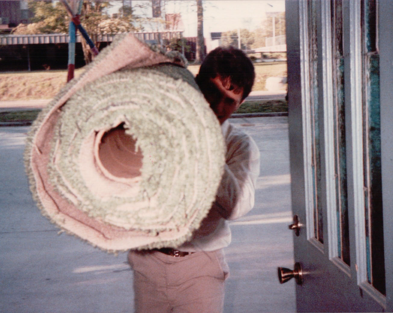 Young Emerson with his carpet roll in the store's earlier days. 